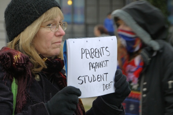Parents against student debt - sign held on London anti-fees protest on 9 December 2010